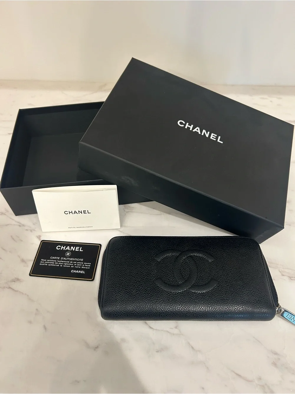 CHANEL Black Quilted Zip Around Wallet with Embossed CC